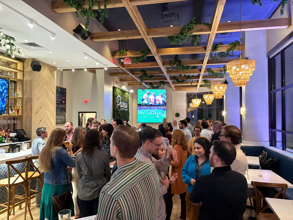 man with pen writing on wall